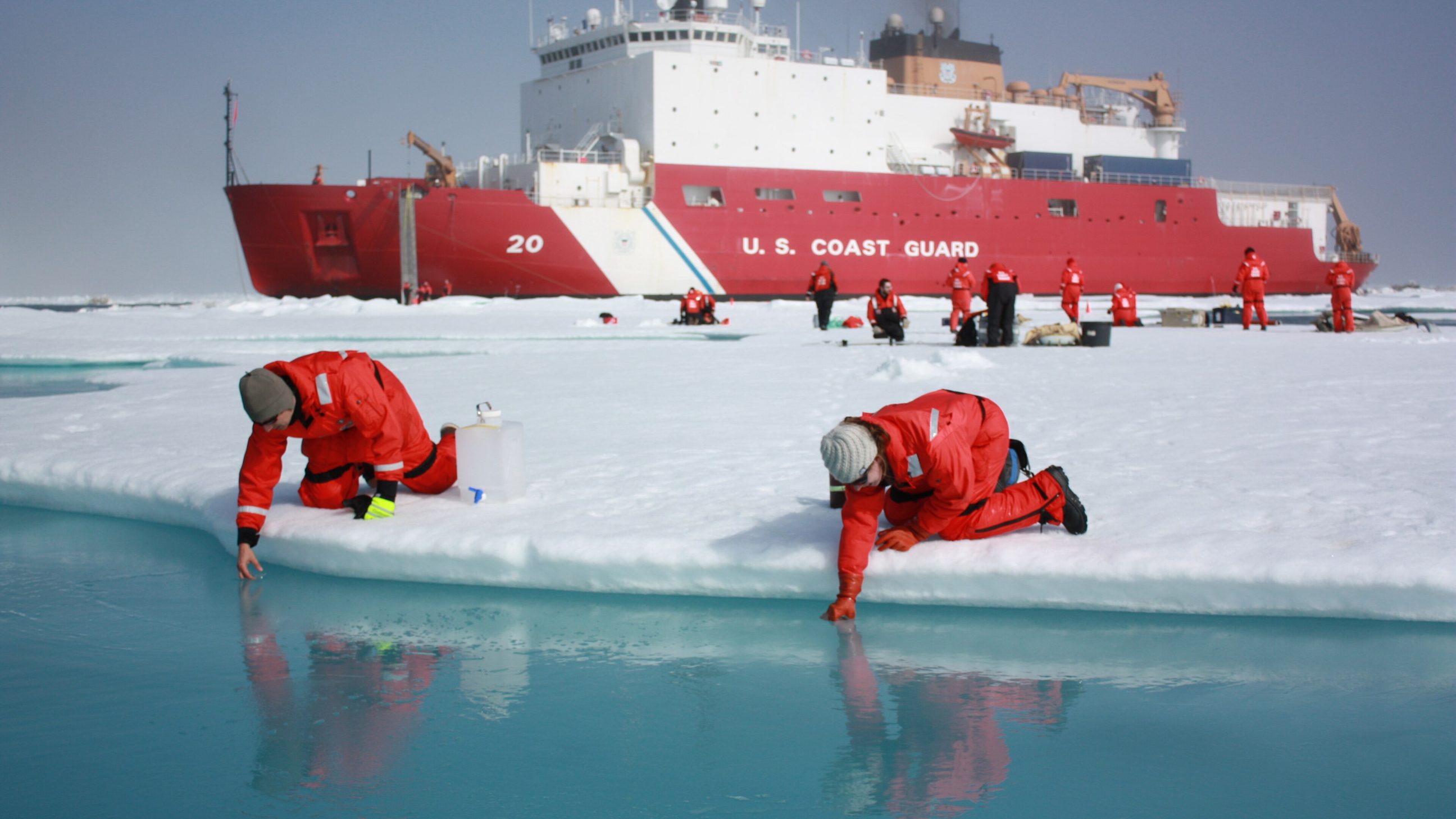 Scientists sample melt ponds on Arctic sea ice
